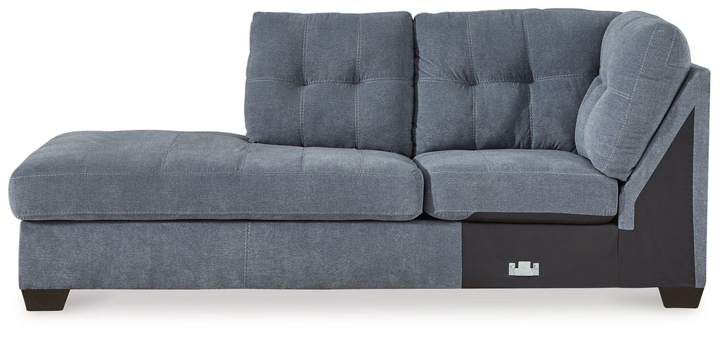 Blue denim corner chaise with tufted backrest, track arm, and dark wood legs