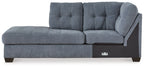 Blue denim corner chaise with tufted backrest, track arm, and dark wood legs