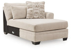 Beige corner chaise sofa section with square arm and fabric throw pillows