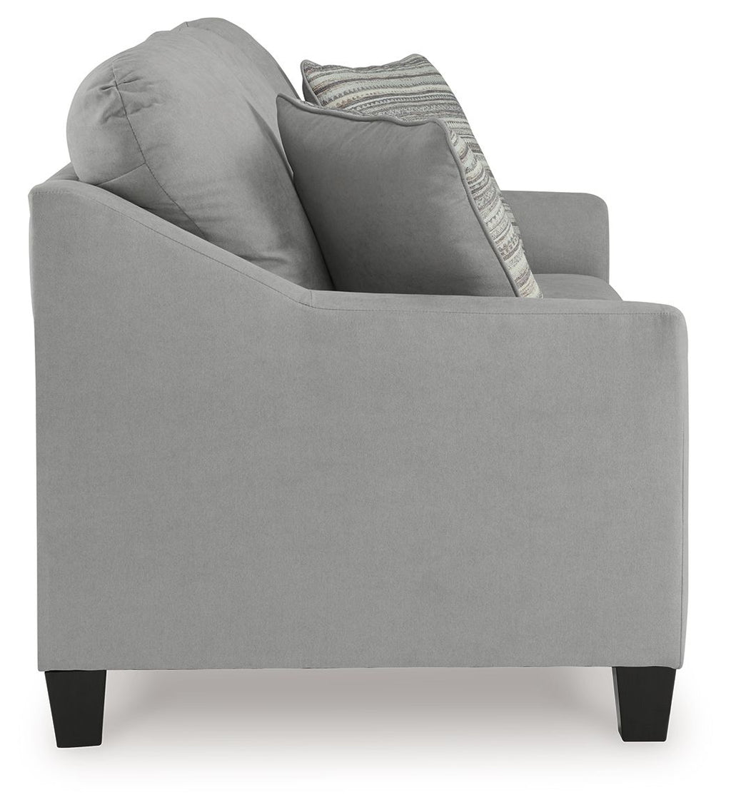 Gray fabric sofa with armrest, backrest cushions, and a striped throw pillow