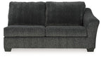 Dark gray fabric sofa sleeper with two-seat cushions and tall boxed back