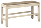 Beige upholstered counter bench with textured brown fabric top and light wood legs