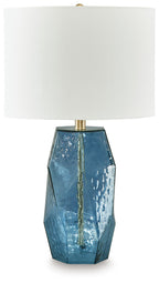 Blue glass table lamp with white fabric shade and brass top, faceted octagon body