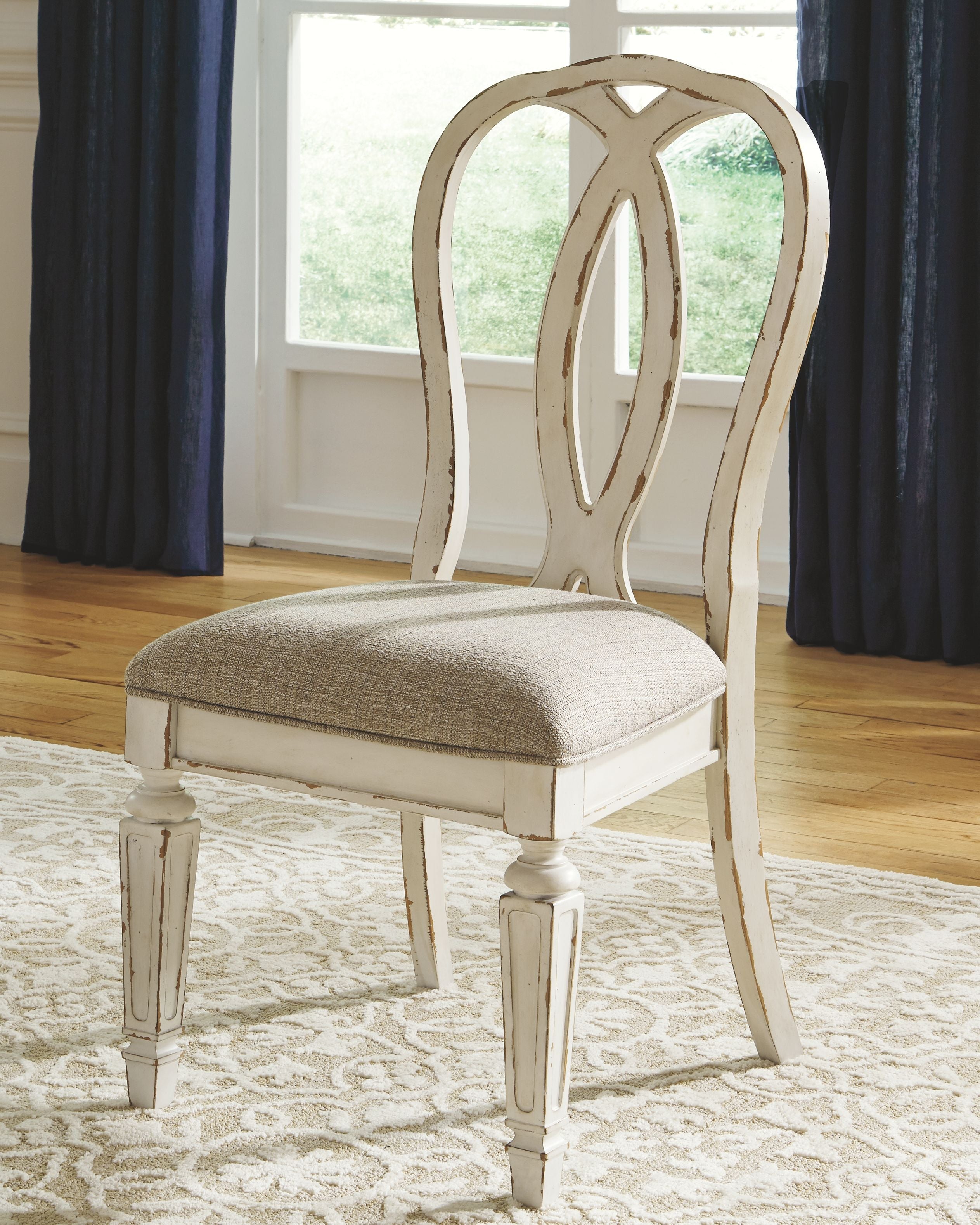 White ladderback dining chair with upholstered seat