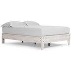 White platform bed frame with white upholstered mattress and low side rails