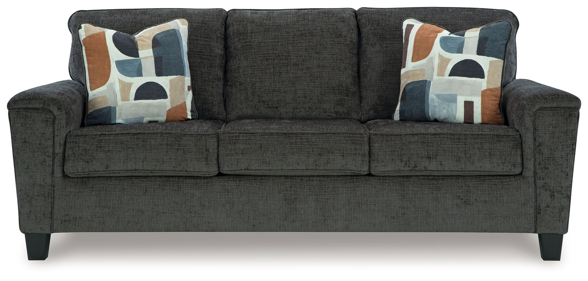 Black upholstered sofa with three seat cushions and four patterned throw pillows