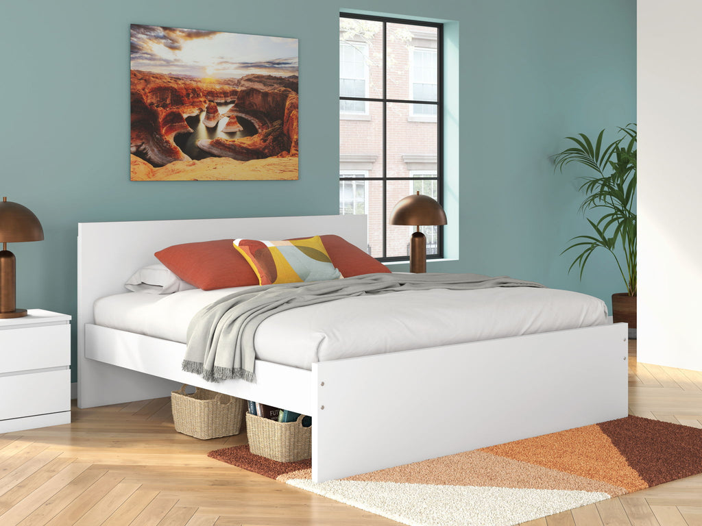 White panel platform bed with slatted support and side drawers, shown with bedding
