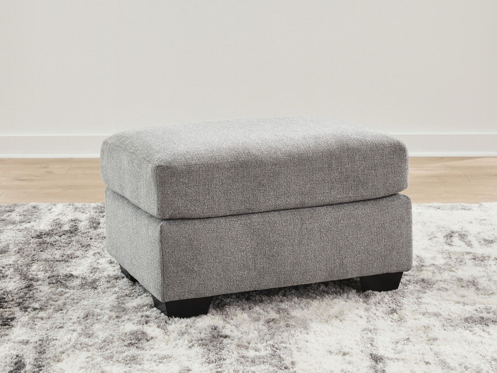Gray fabric ottoman with rectangular top and dark block legs