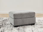 Gray fabric ottoman with rectangular top and dark block legs