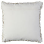 Square decorative pillow with smooth front and braided pom-pom border