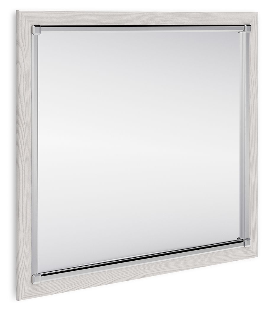 Rectangular bedroom mirror with light wood frame and clear glass