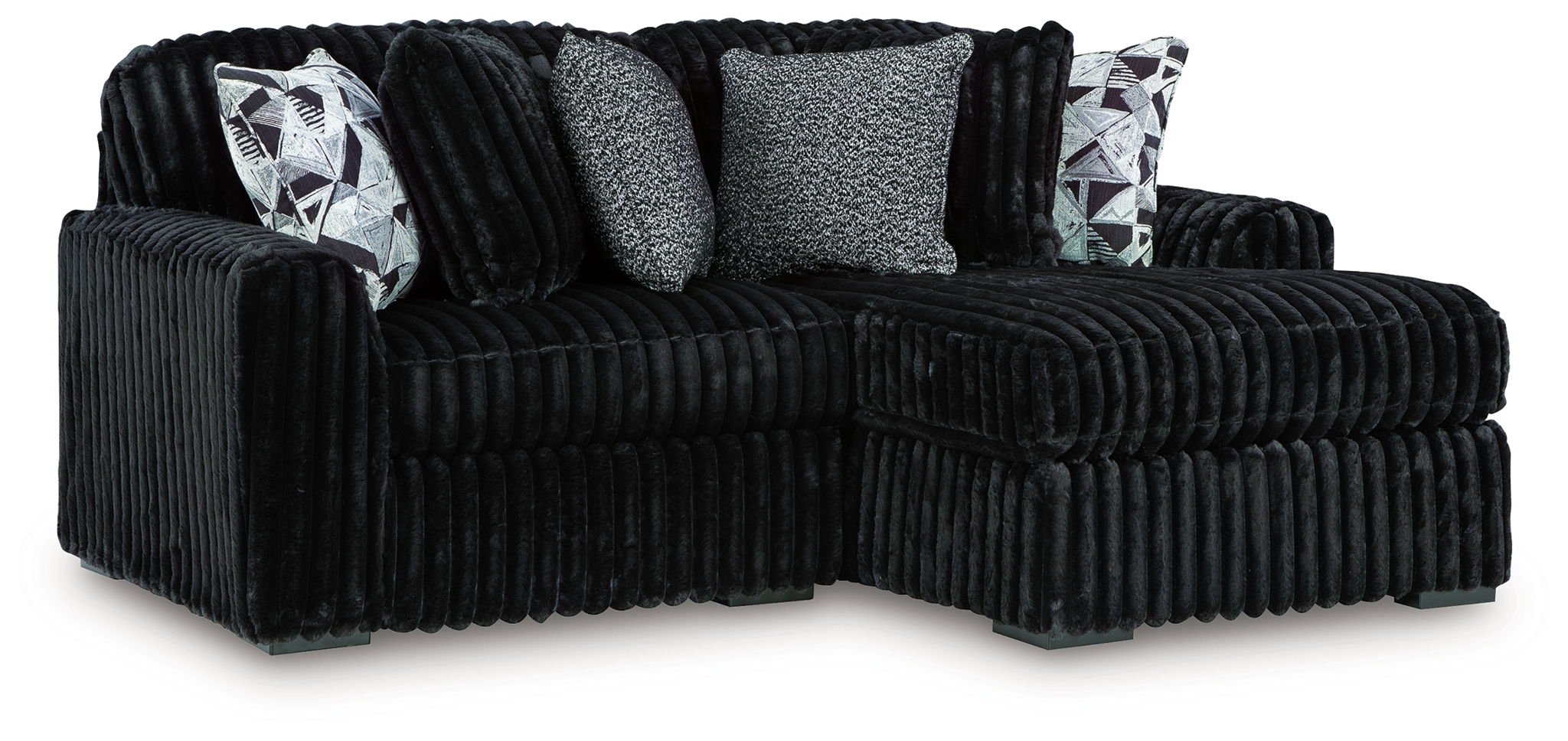 Sectional sofa with chaise, black corded upholstery and decorative geometric pillows