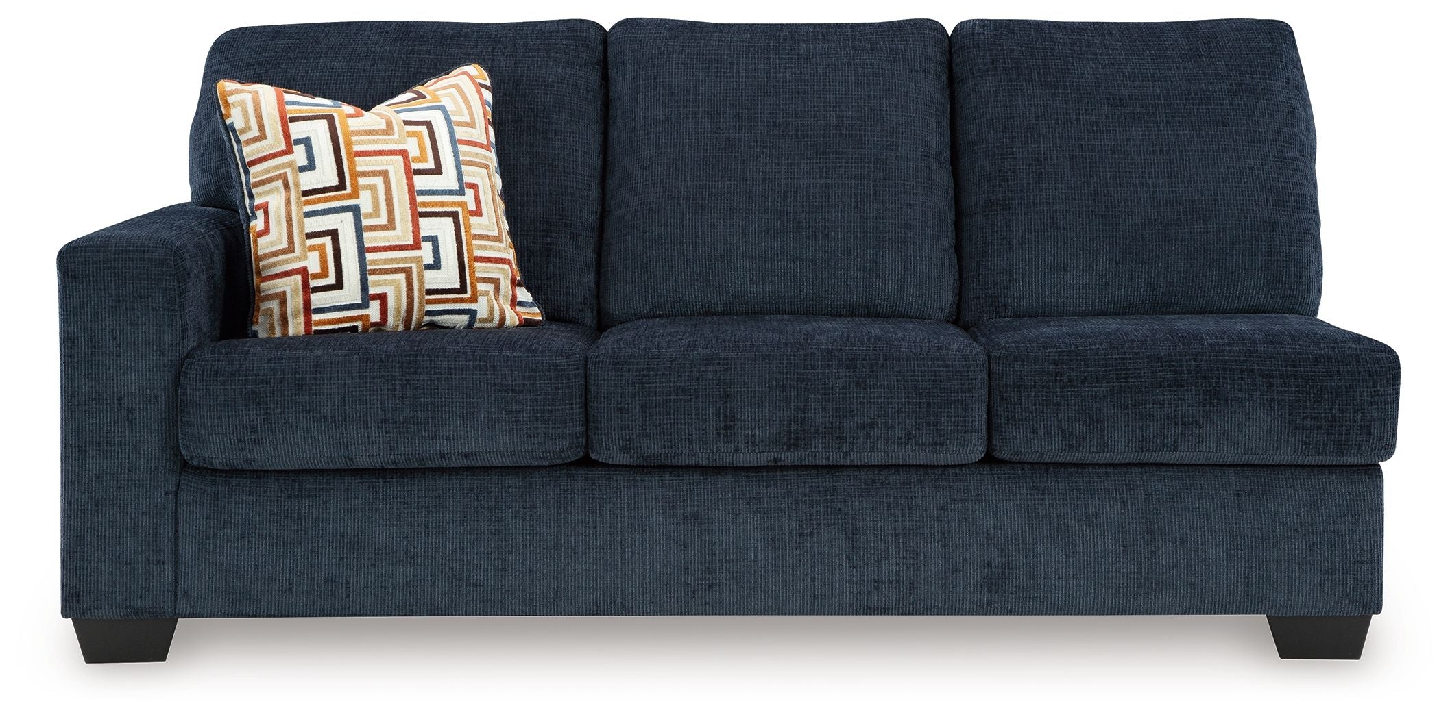 Ink blue fabric sofa front view with square arms, three seat cushions, and patterned throw pillow