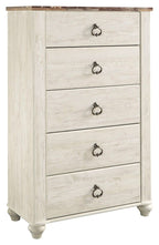 Distressed light wood five-drawer chest with decorative dark metal drawer pulls