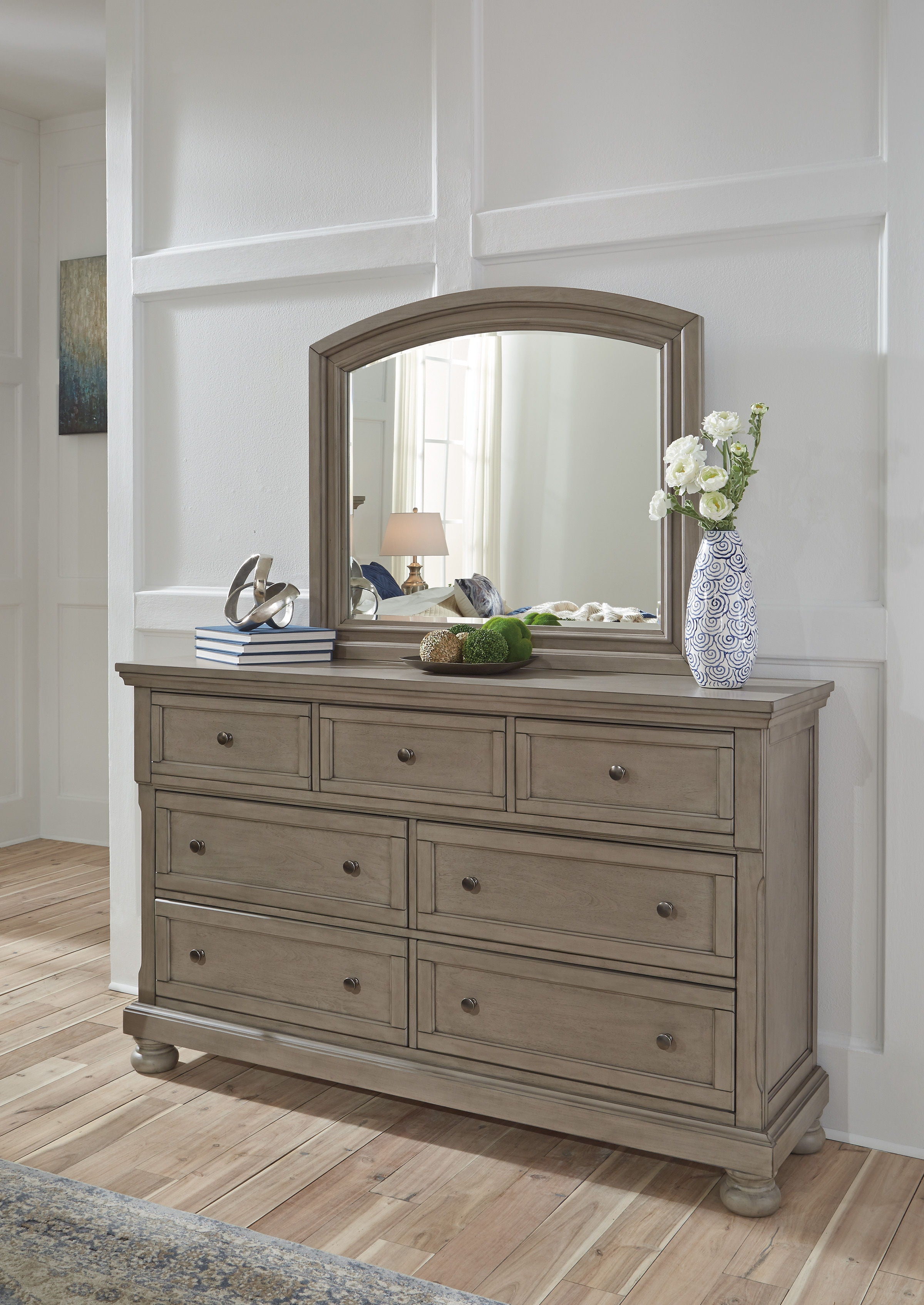 Light gray Lettner dresser with arched mirror above and drawers below