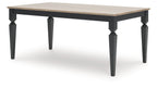 Rectangular dining table with light wood surface and dark legs