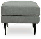 Charcoal upholstered ottoman with plush top cushion and tapered black legs