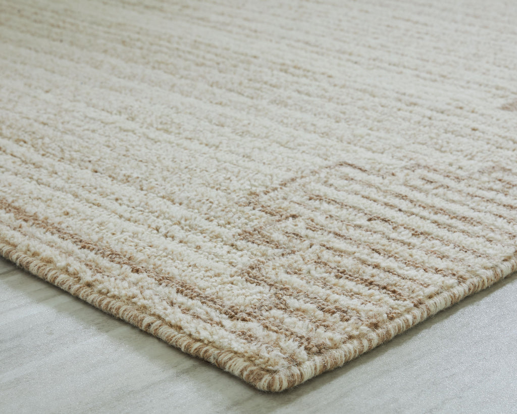 Beige rug surface with dense textured pattern and low pile