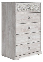 Whitewash chest of drawers with ornate top panel, five drawers, round metal knobs