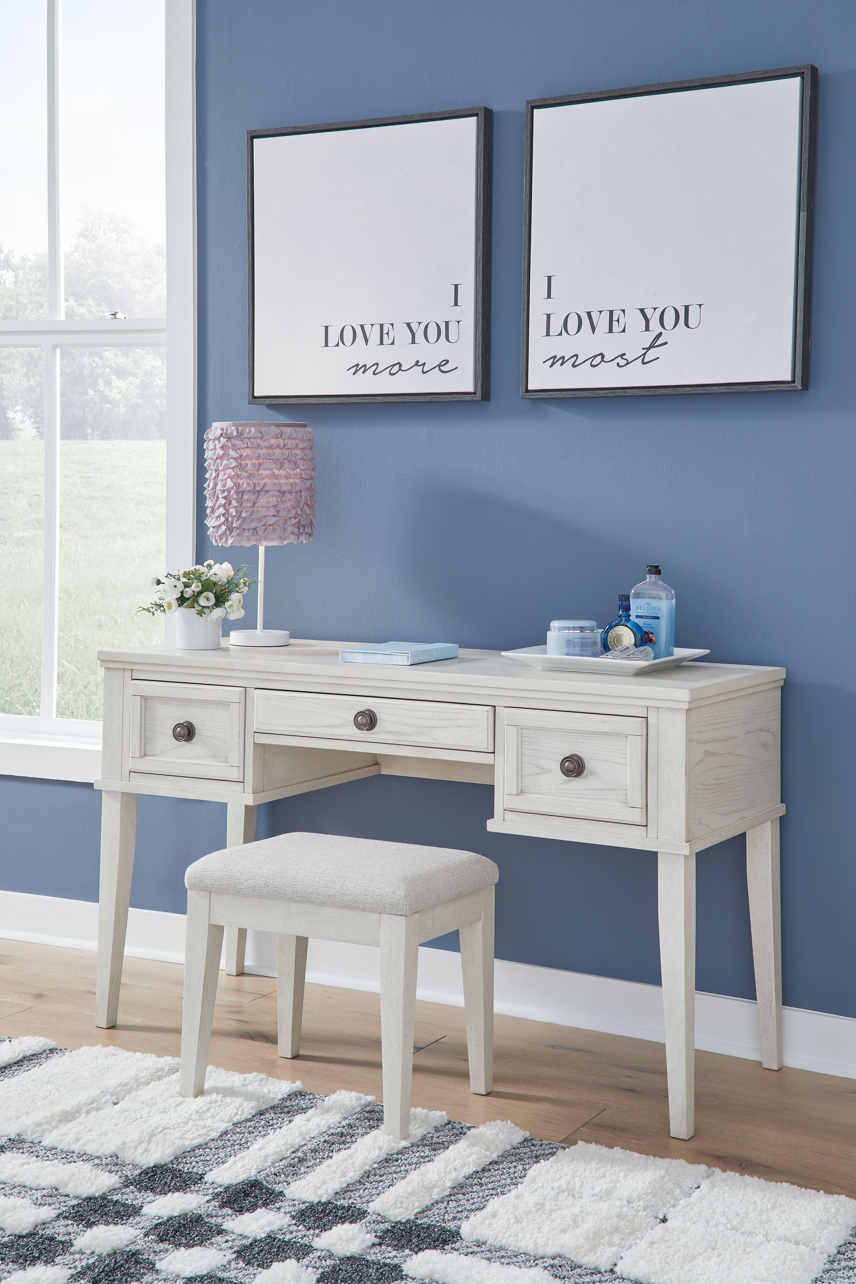 Antique white vanity table with open drawers and matching stool, set with two wall mirrors.