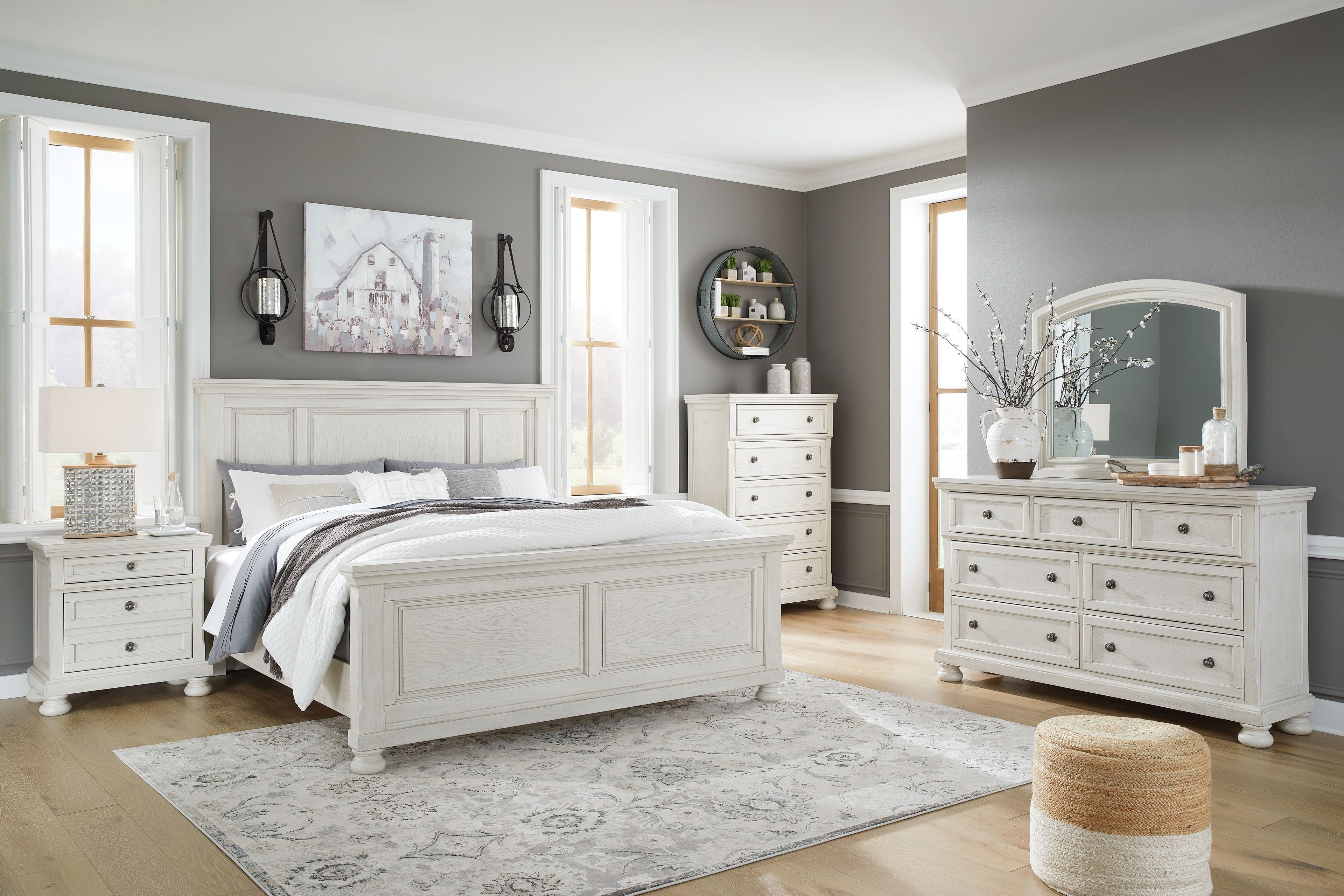 White panel bedroom set with bed, dresser, and mirror