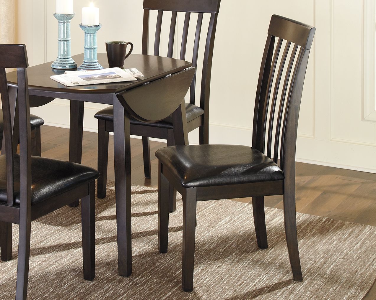 Dark brown upholstered dining side chair with vertical slat back and padded seat