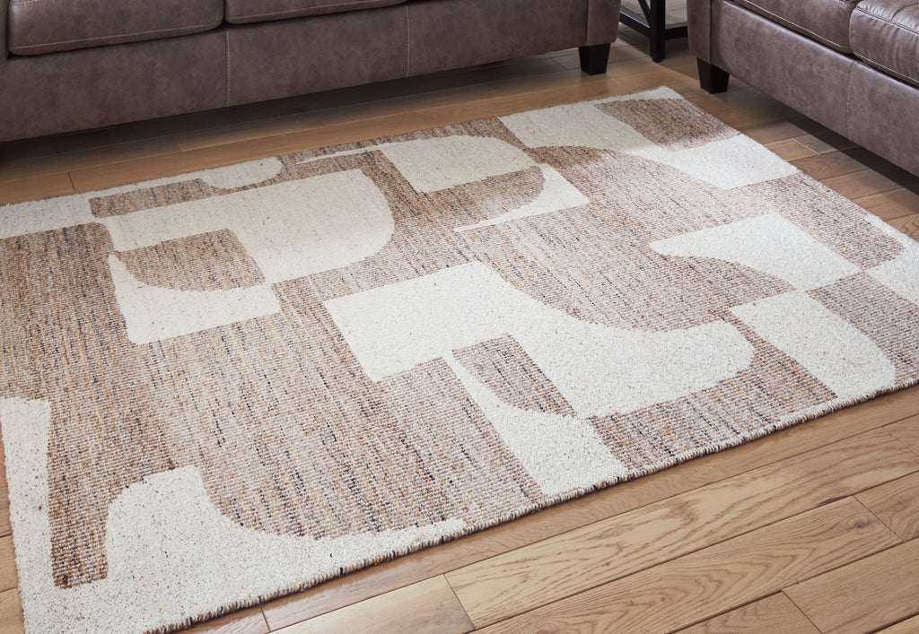 Beige and white geometric rug on wood floor with flat woven texture