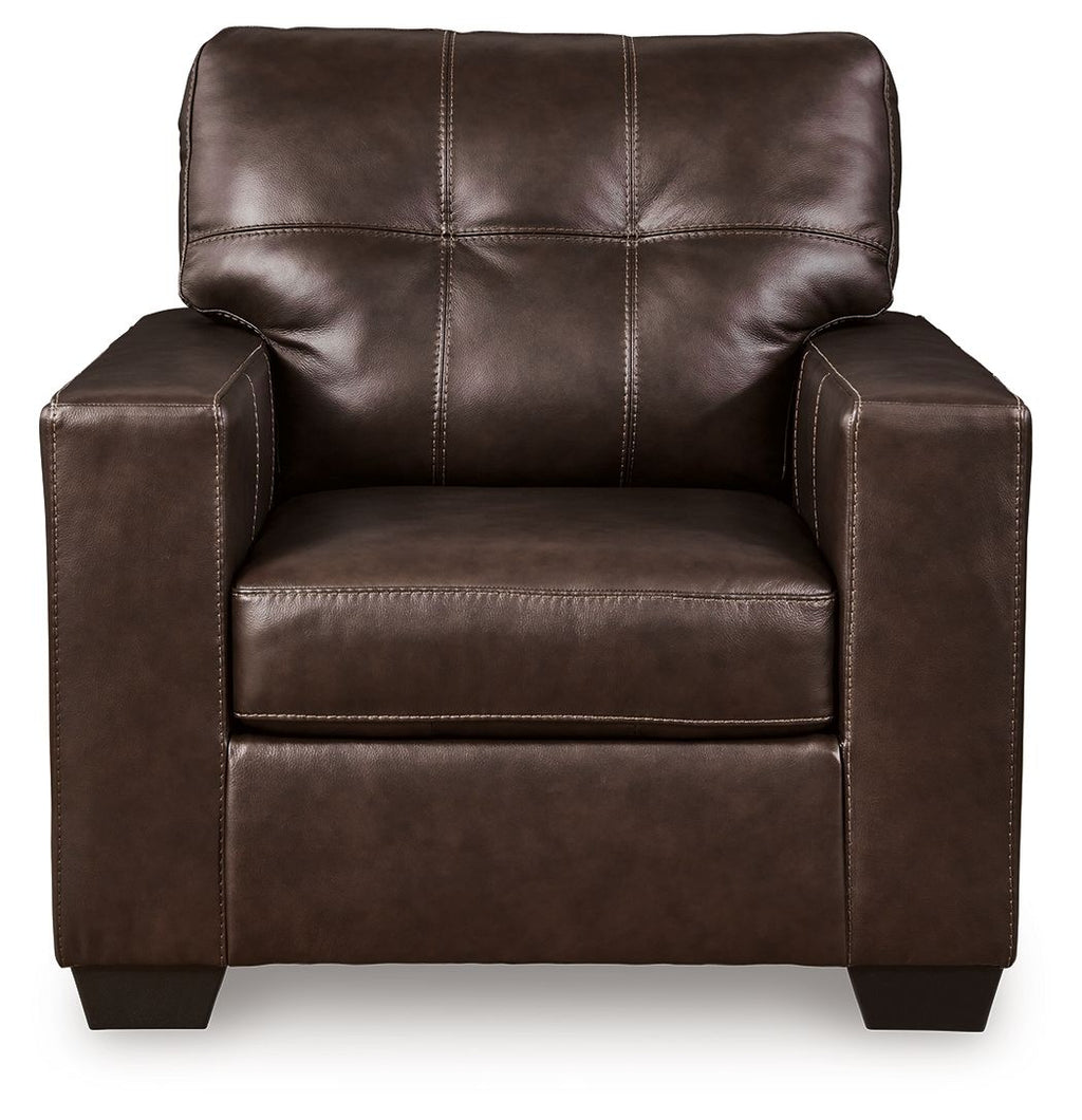 Dark brown leather accent chair front view with tufted back and arm pads