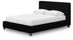 Black upholstered platform bed with tall headboard and two white pillows.