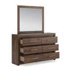 Light brown dresser with attached mirror and three drawer pairs with bar handles.