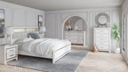 Altyra panel bookcase bedroom set: white bed, dresser, and mirror in a bedroom