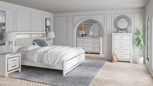 Altyra panel bookcase bedroom set: white bed, dresser, and mirror in a bedroom