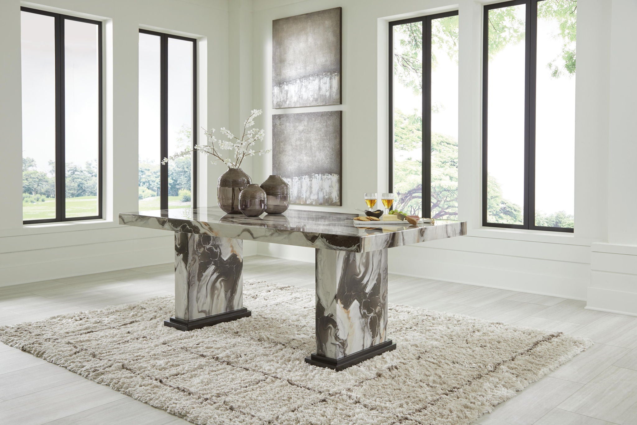 Rectangular dining table with marble-look stone finish and dark base legs