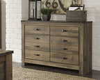 Dark brown six-drawer dresser with six drawers and dark metal bar pulls