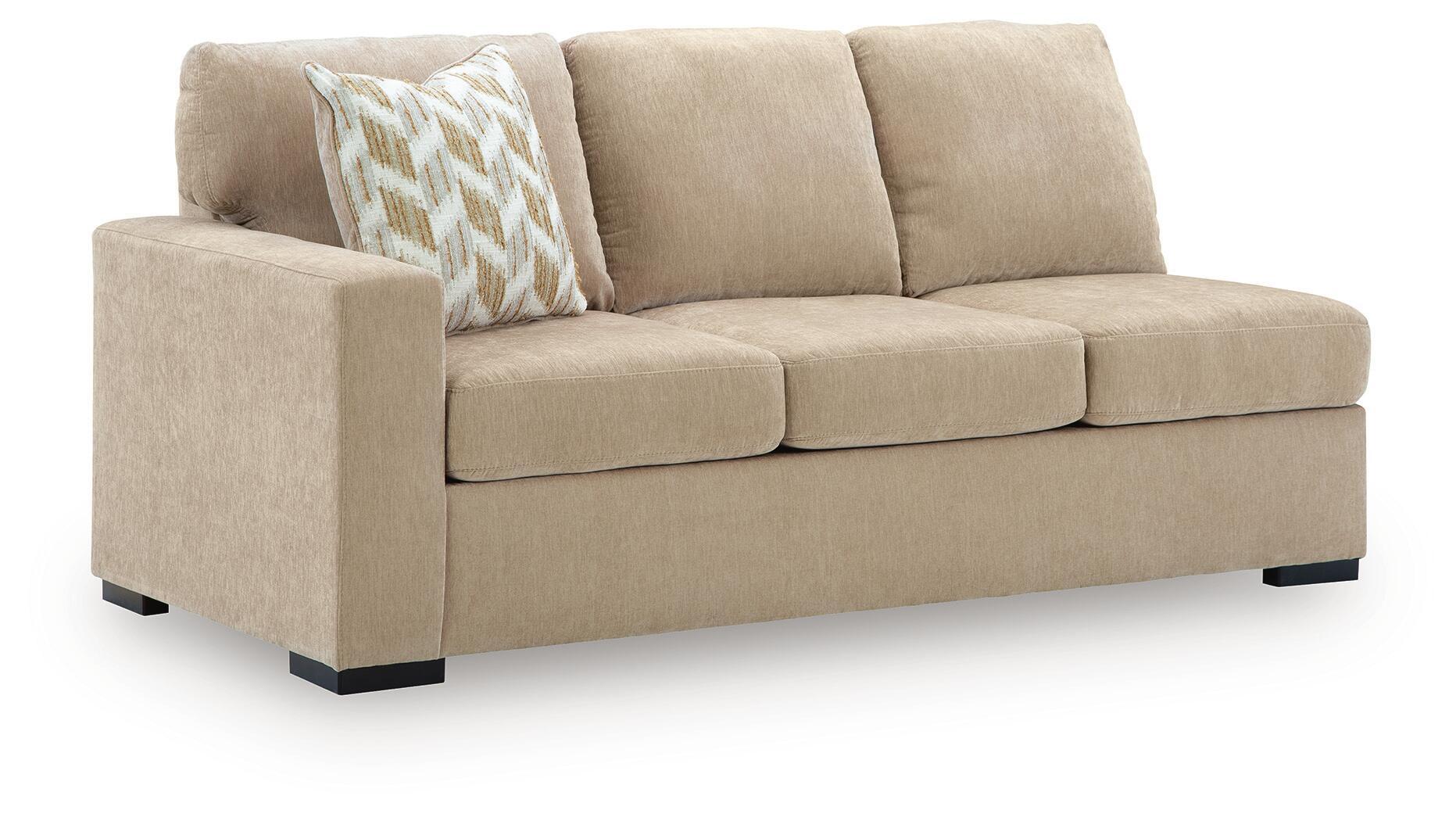 Almond left-arm facing sofa in beige fabric with patterned throw pillow and black feet