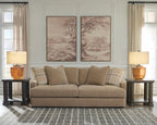 Sofa with light beige upholstery and plaid throw pillows, 3 back cushions
