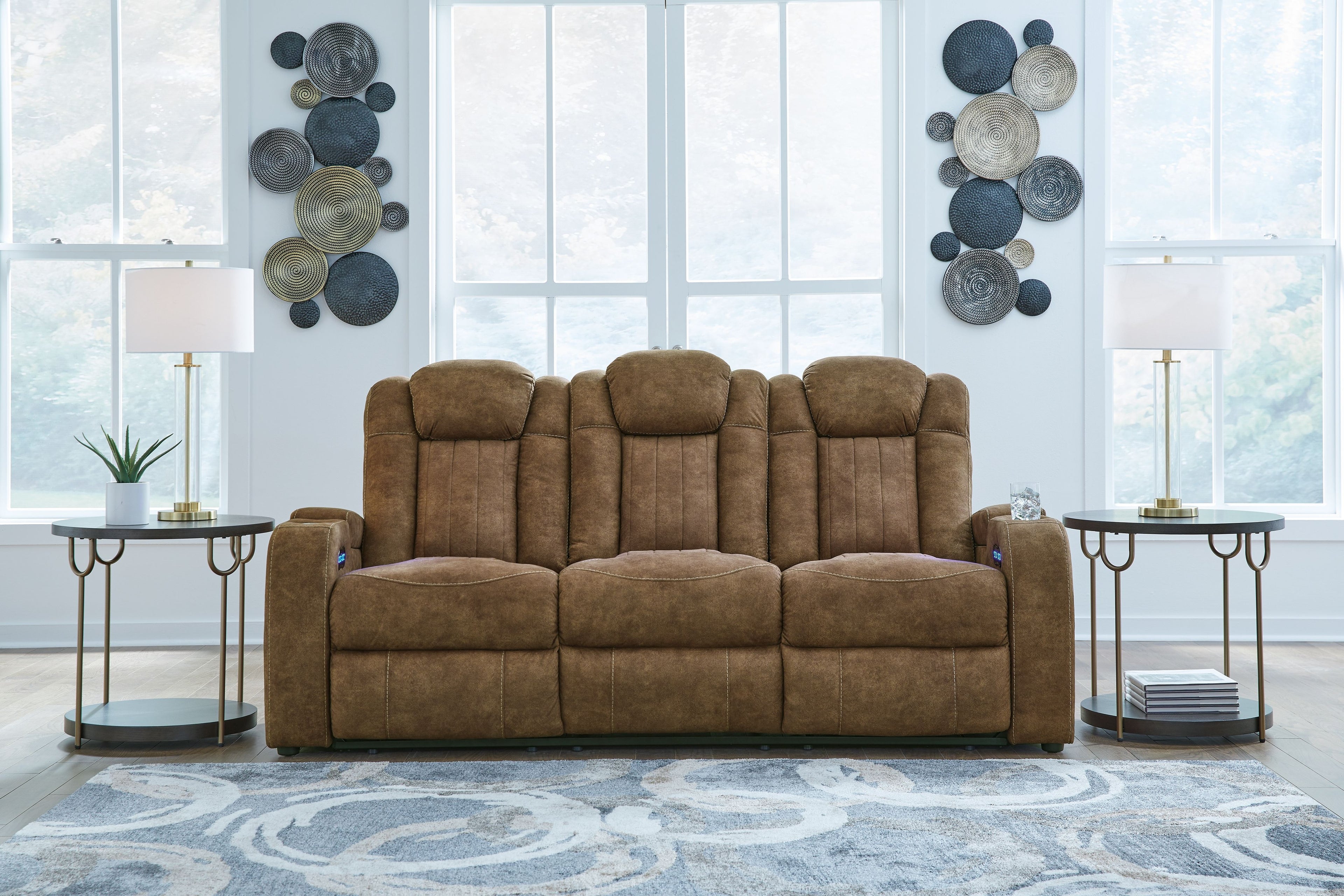 Brindle power reclining sofa with three seat sections and tall tufted back, dark brown