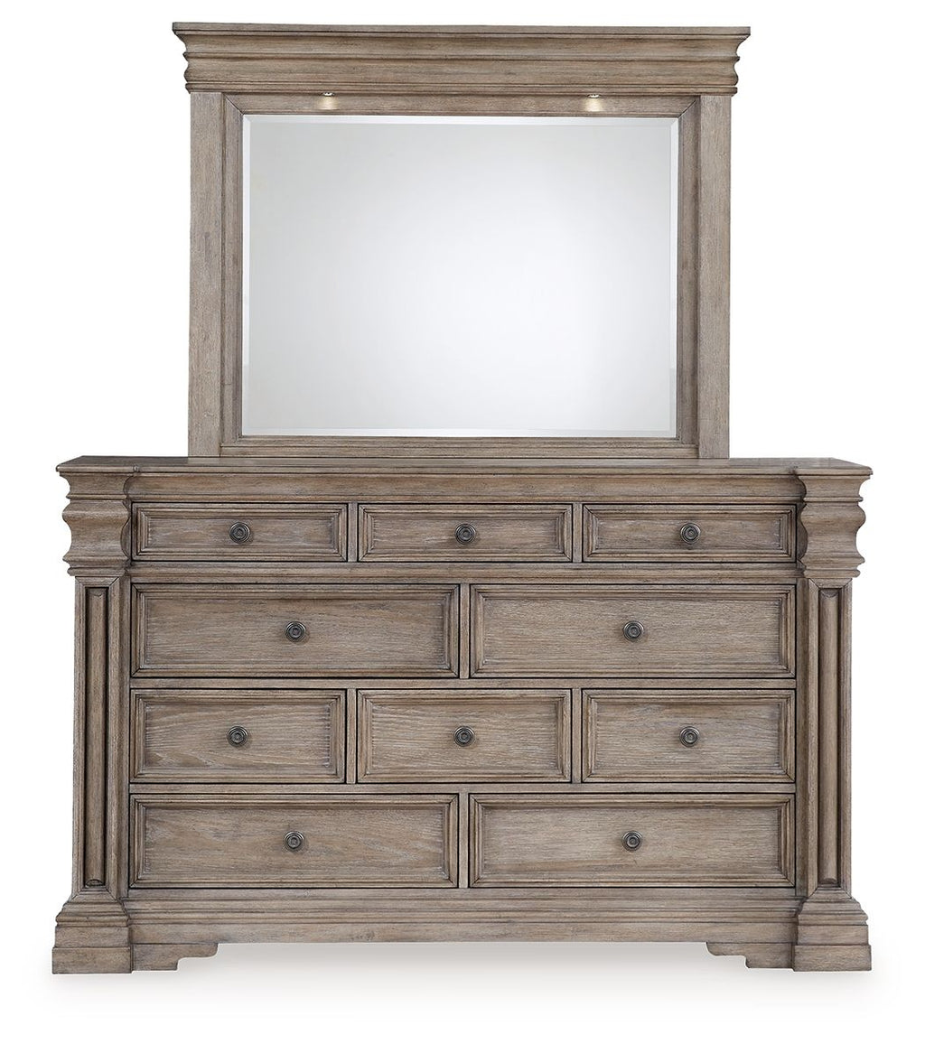 Grayish brown dresser with rectangular mirror, stacked drawers and antique-style hardware