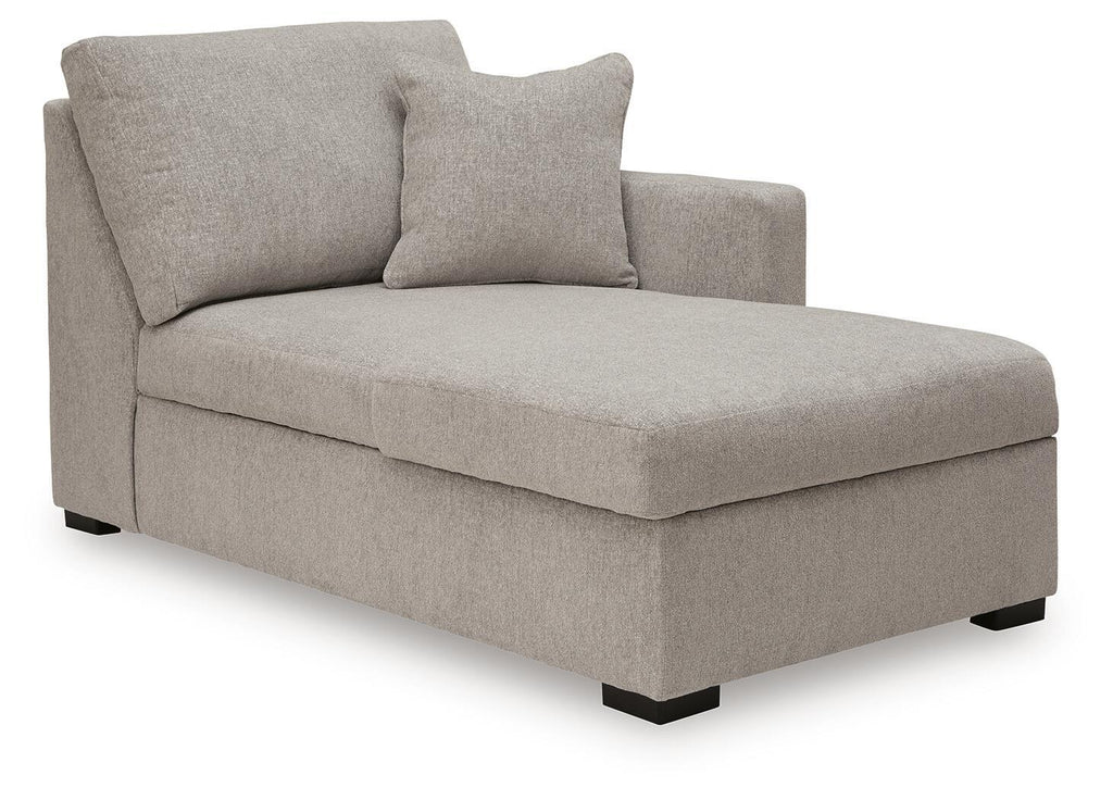 Light gray corner chaise with padded seat and two back cushions, squared arms