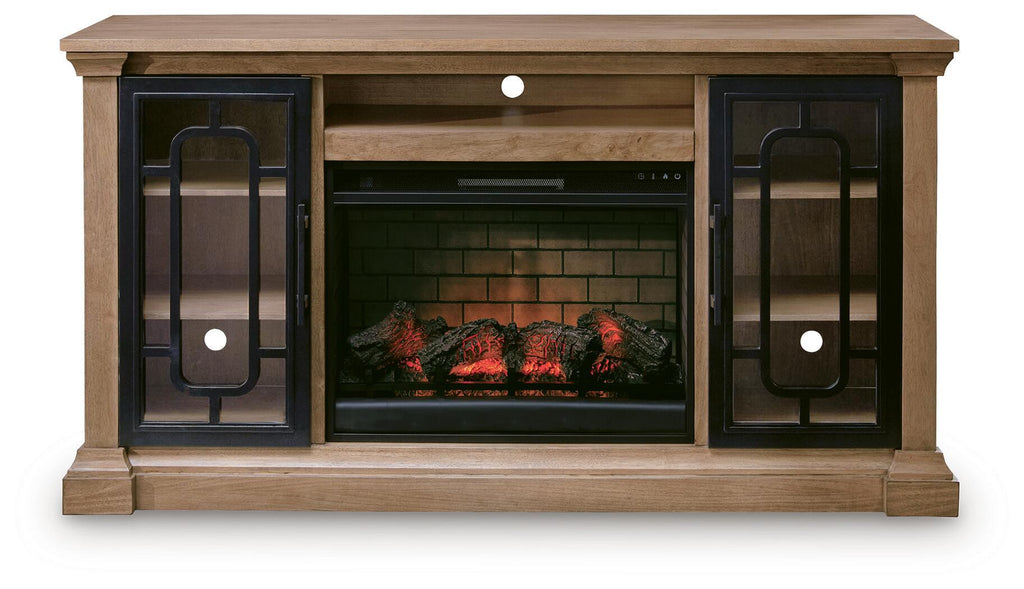 Light brown TV stand with two glass-front doors and electric fireplace insert with glowing flames.