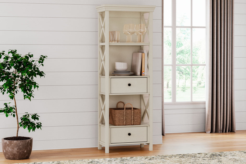 Antique white display cabinet with open shelves, two drawers, and decorative X panels