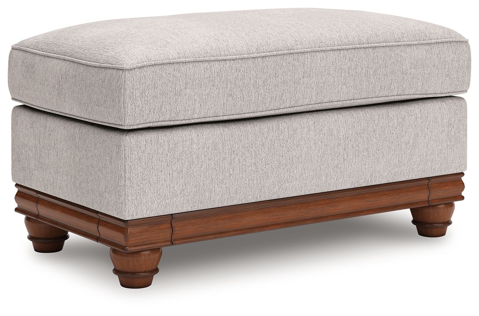 Sandstone upholstered ottoman with padded seat, wood base, and turned legs