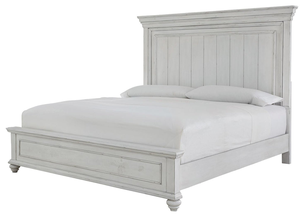 White panel bed with tall headboard, low footboard, and matching wooden side rails.