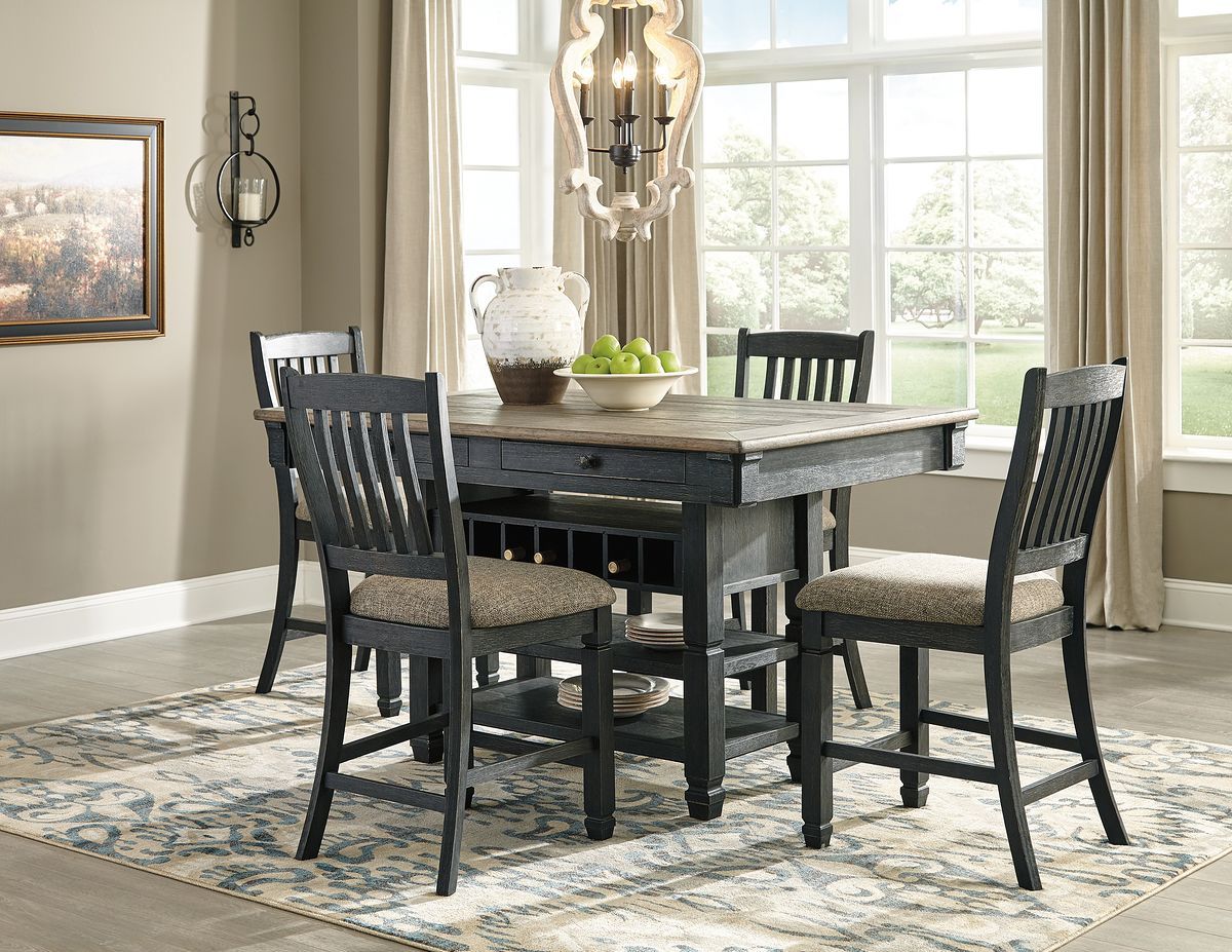 Dark gray counter height dining table with four slat-back bar stools