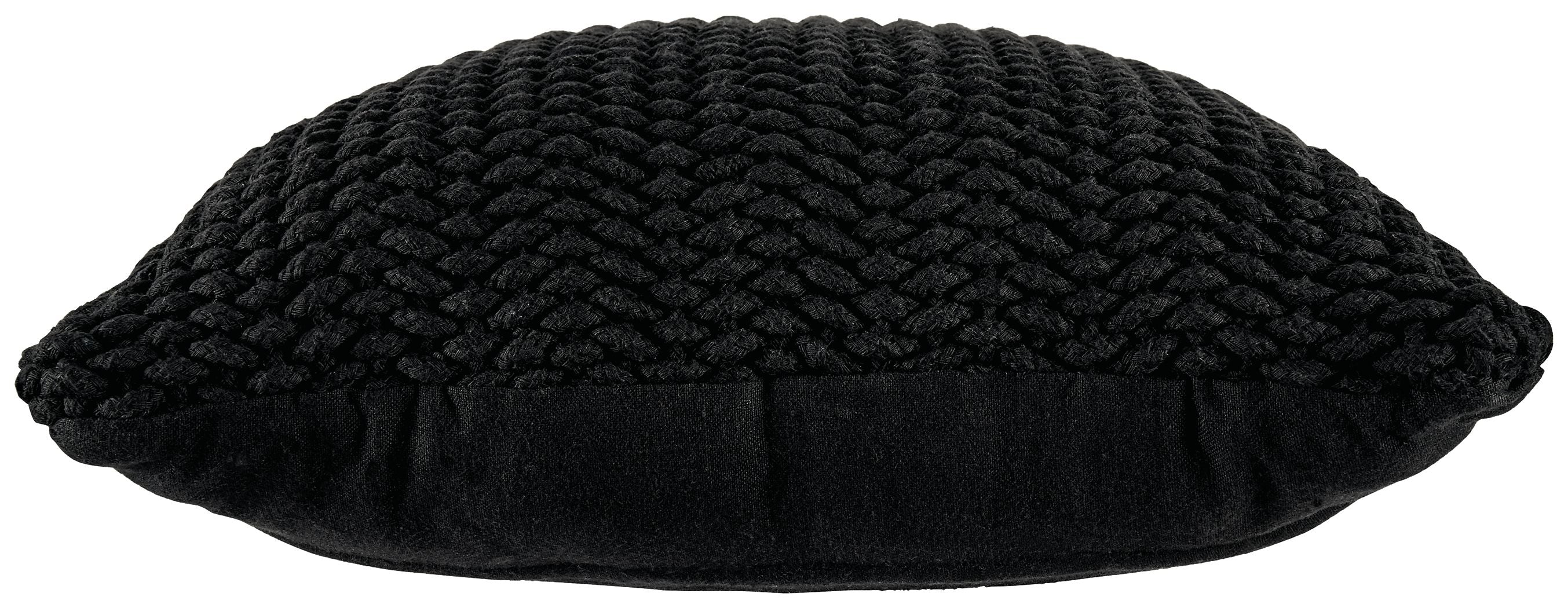 Black knitted pillow with rounded edges and chunky braided texture, side view.