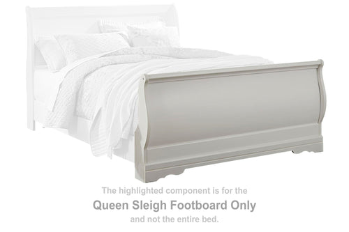 White queen sleigh style bed footboard with rounded panel and molding