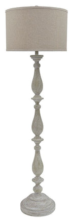 Whitewash poly floor lamp with beige fabric drum shade and carved pedestal base