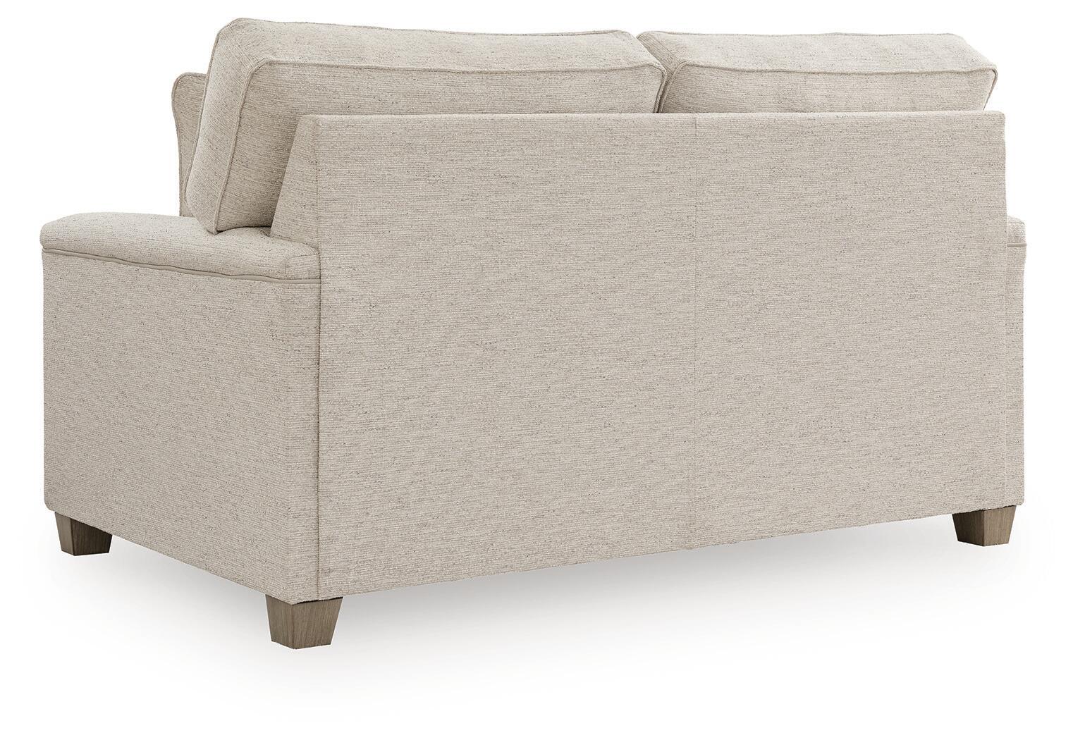Light beige upholstered loveseat with rolled arms and three back cushions