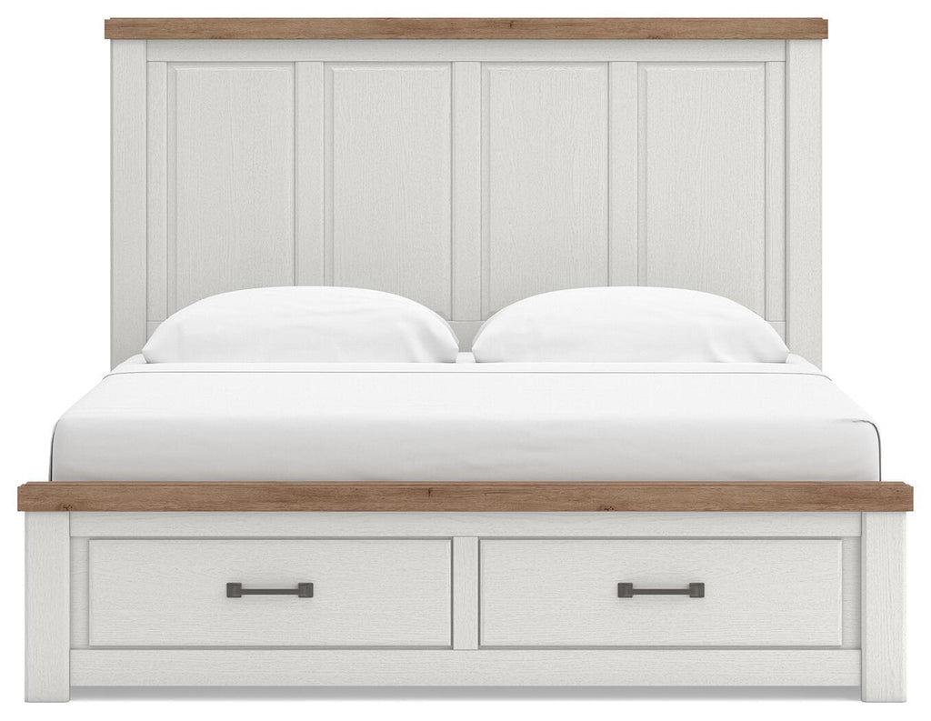 White panel storage bed with wood-trim headboard and two center pull-out drawers, front view