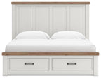 White panel storage bed with wood-trim headboard and two center pull-out drawers, front view